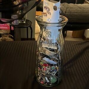 Assorted Jewelry Collection in Glass Vase